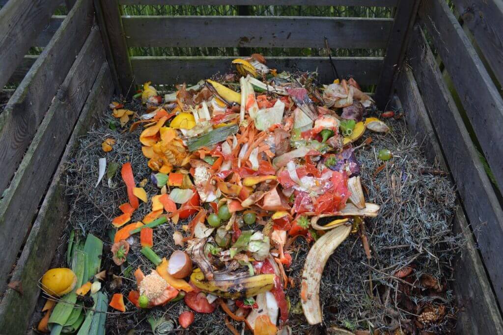 how to make compost, kitchen scraps in compost pile