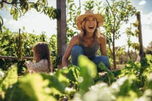 Ways to make gardening fun Beautiful,Young,Female,Farmer,Working,In,Her,Garden,With,He