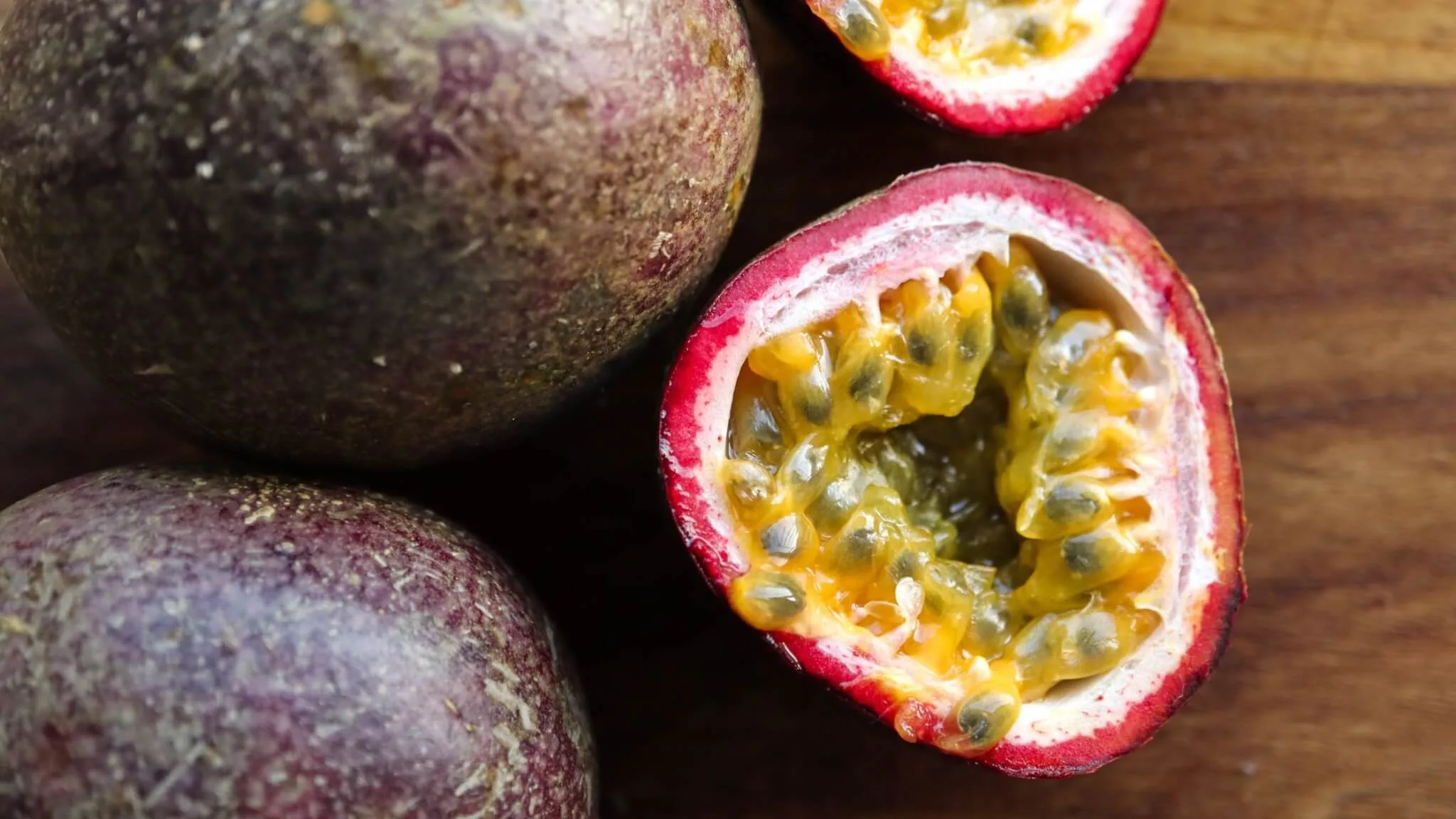 cut granadilla fruit on table